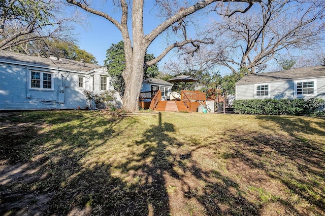 view of yard featuring a wooden deck