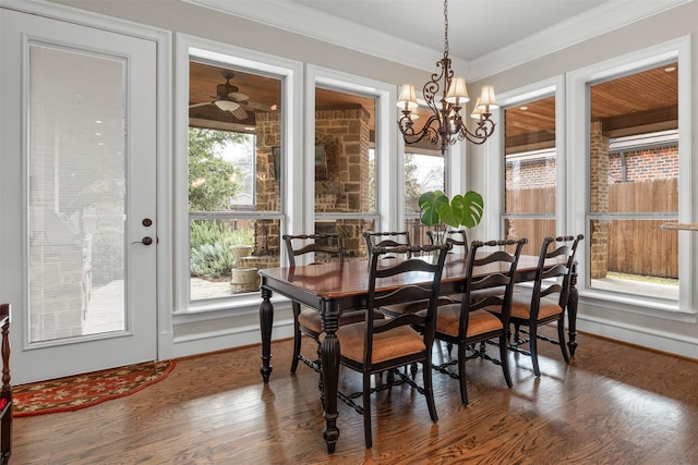 dining space with ornamental molding and dark wood-type flooring