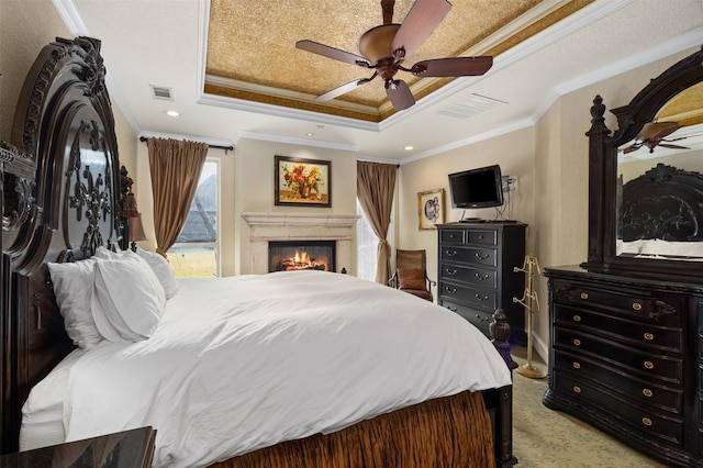 carpeted bedroom with a raised ceiling, crown molding, access to exterior, and ceiling fan