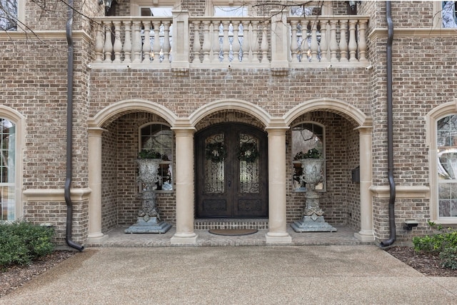 property entrance featuring french doors