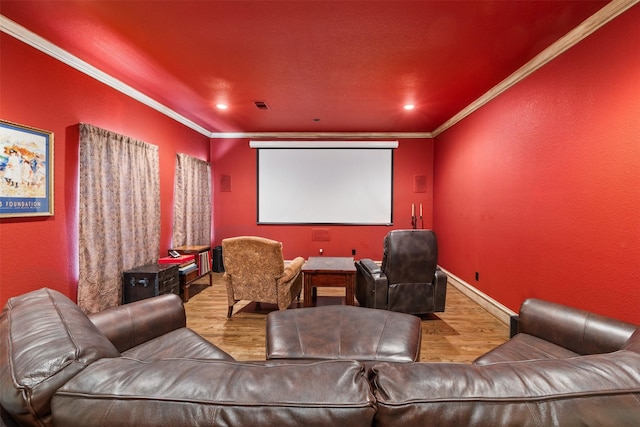 cinema with hardwood / wood-style flooring and ornamental molding