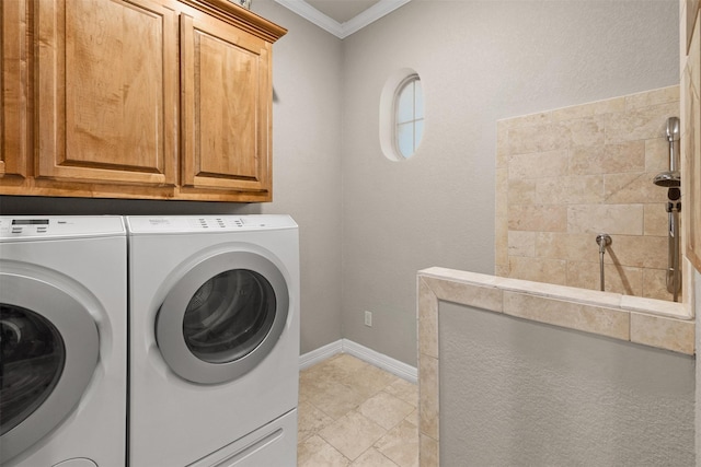 laundry area with cabinets, crown molding, and independent washer and dryer