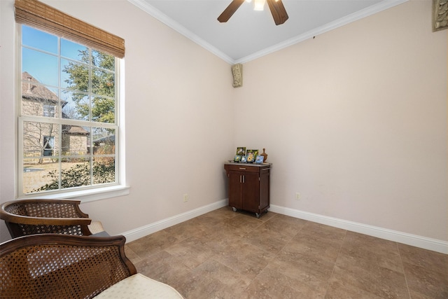 living area featuring crown molding and ceiling fan