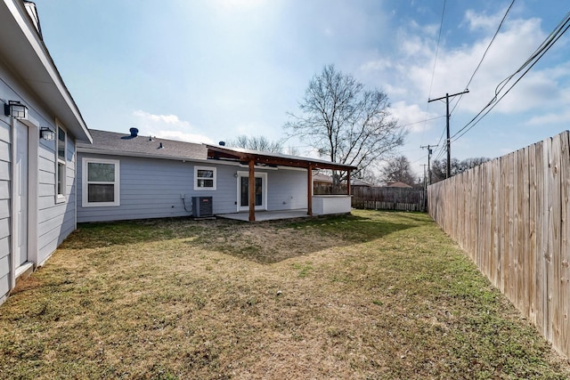 view of yard featuring central AC and a patio