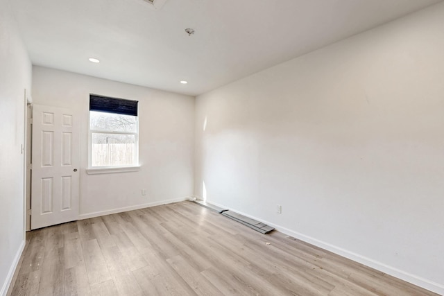 unfurnished room featuring light hardwood / wood-style flooring