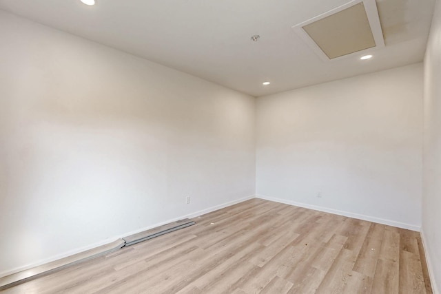 empty room with light hardwood / wood-style floors