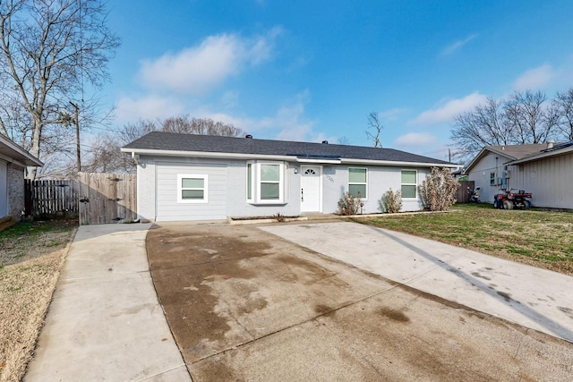 ranch-style home with a patio and a front yard