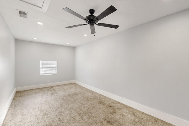 spare room featuring ceiling fan and carpet floors