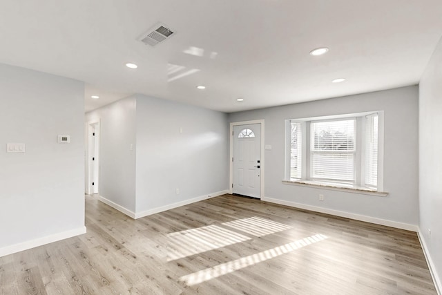 entryway with light hardwood / wood-style flooring