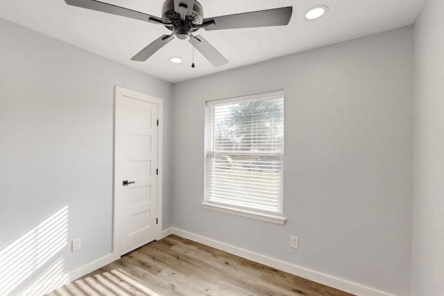 unfurnished room featuring light hardwood / wood-style flooring and ceiling fan