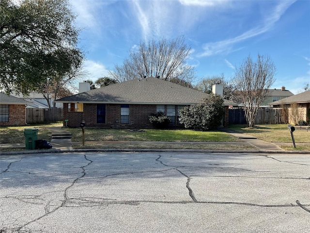 single story home with a front yard