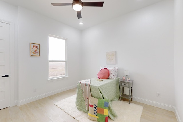 bedroom with ceiling fan and light hardwood / wood-style floors