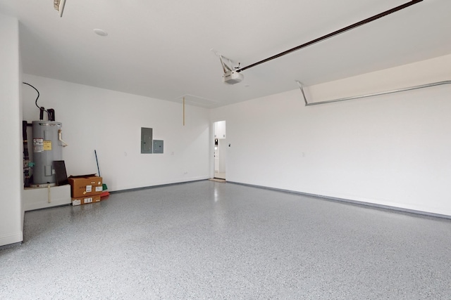 garage with a garage door opener, electric panel, and electric water heater