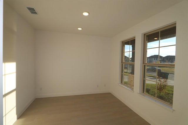 spare room featuring hardwood / wood-style flooring