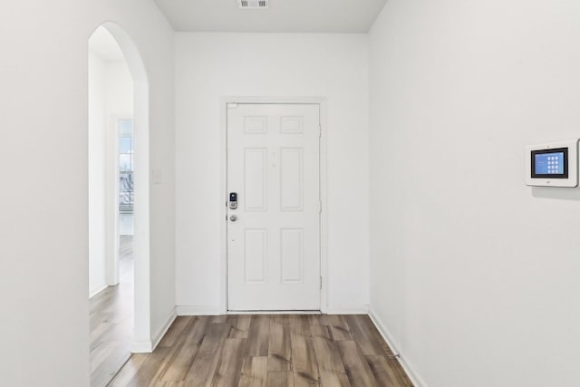 entryway with hardwood / wood-style floors