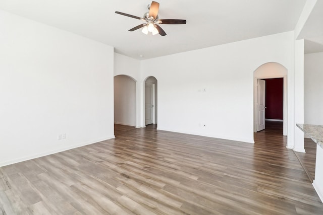 unfurnished room with hardwood / wood-style flooring and ceiling fan