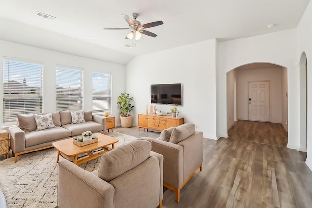 living room featuring hardwood / wood-style flooring, ceiling fan, and lofted ceiling