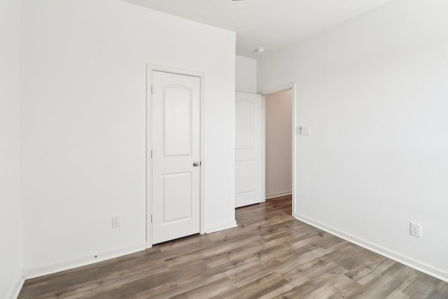 unfurnished bedroom with light wood-type flooring