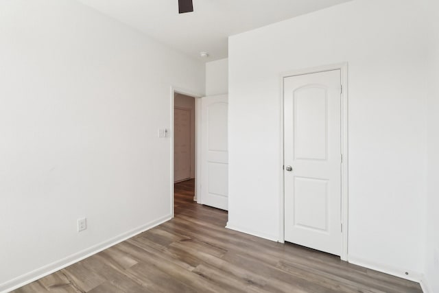 unfurnished bedroom featuring ceiling fan and hardwood / wood-style floors