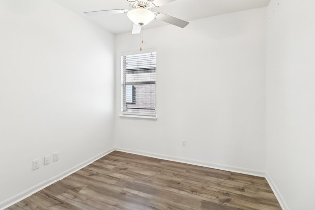 spare room with hardwood / wood-style floors and ceiling fan