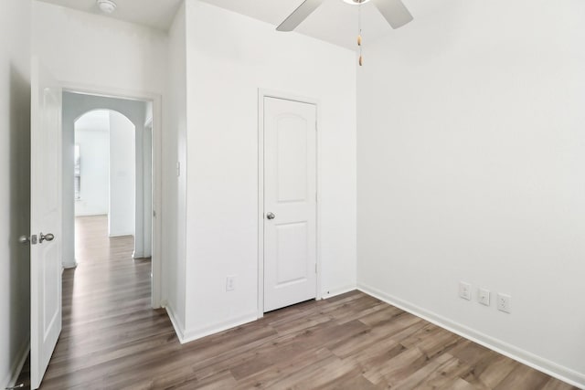 unfurnished bedroom featuring ceiling fan and wood-type flooring