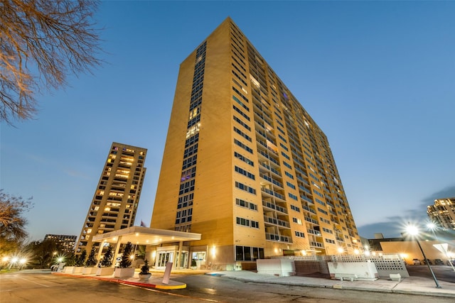 view of outdoor building at dusk