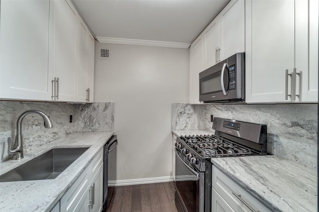 kitchen featuring white cabinetry, sink, and stainless steel appliances