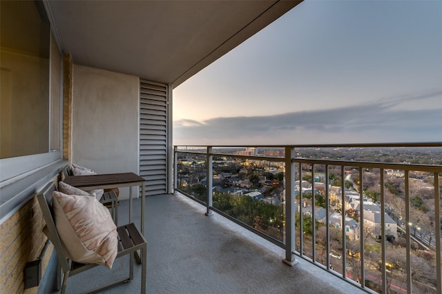 view of balcony at dusk