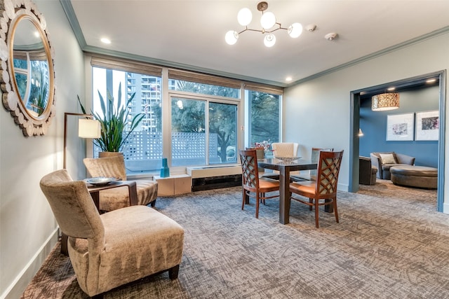 dining space featuring crown molding, a chandelier, and carpet