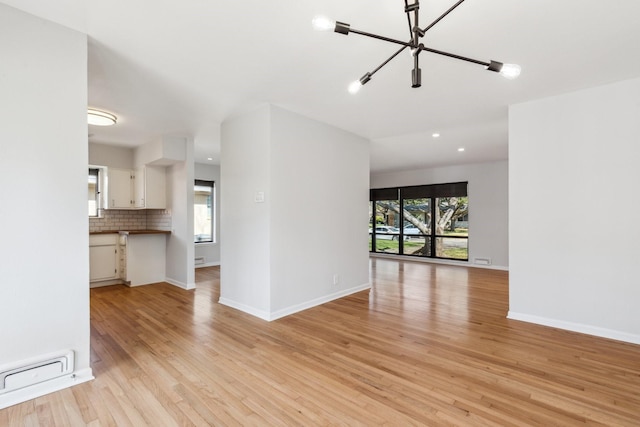 unfurnished living room featuring light hardwood / wood-style floors