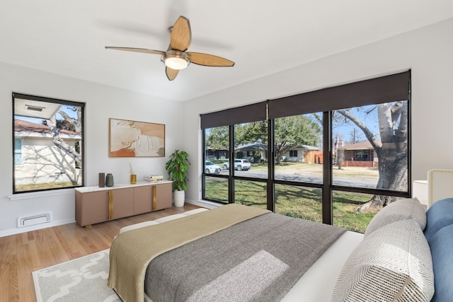 bedroom featuring ceiling fan and light wood-type flooring