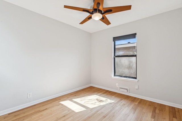 empty room featuring ceiling fan and light wood-type flooring