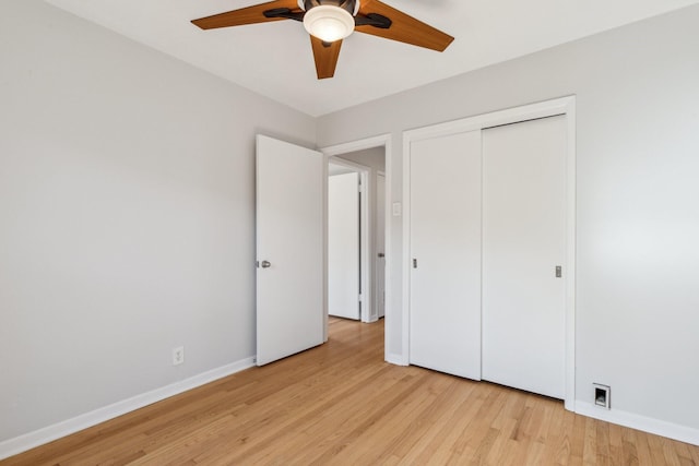 unfurnished bedroom with a closet, ceiling fan, and light hardwood / wood-style flooring