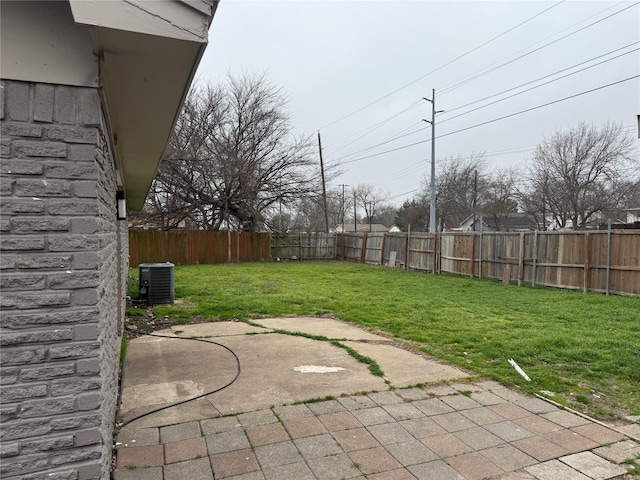 view of yard with a patio area and central air condition unit