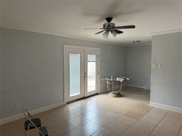 tiled spare room featuring french doors, ceiling fan, and crown molding