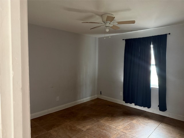 spare room with ceiling fan