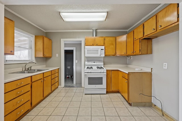 kitchen featuring sink, white appliances, light tile patterned floors, ornamental molding, and a textured ceiling