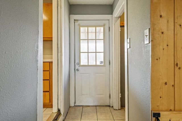 entryway featuring light tile patterned floors