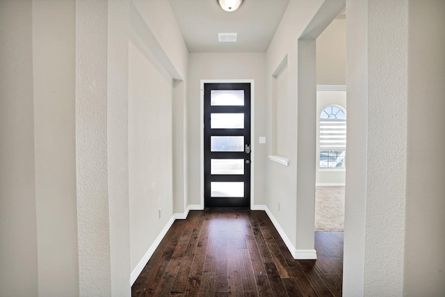 foyer entrance featuring dark hardwood / wood-style flooring