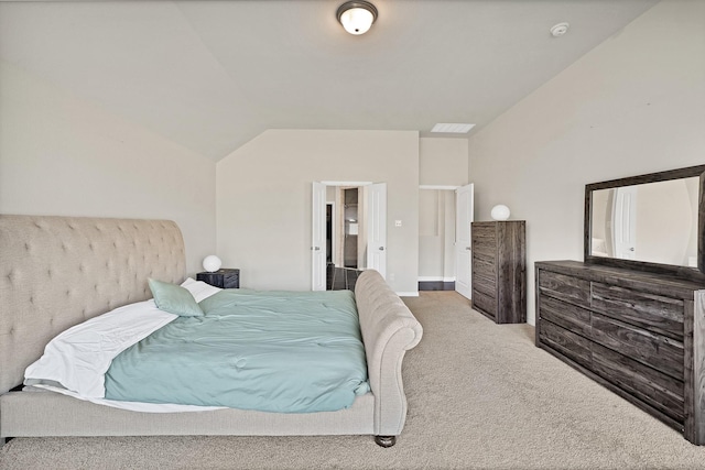 carpeted bedroom with vaulted ceiling