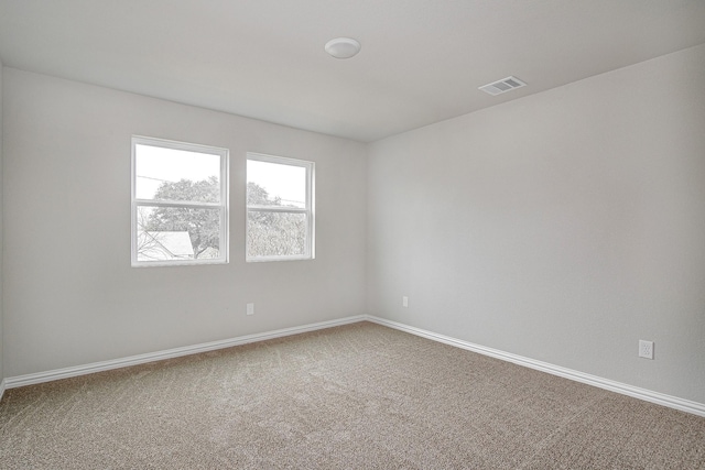 spare room with carpet flooring