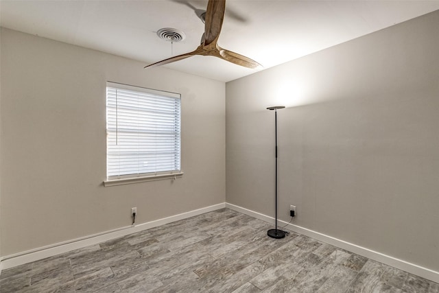 spare room with wood-type flooring