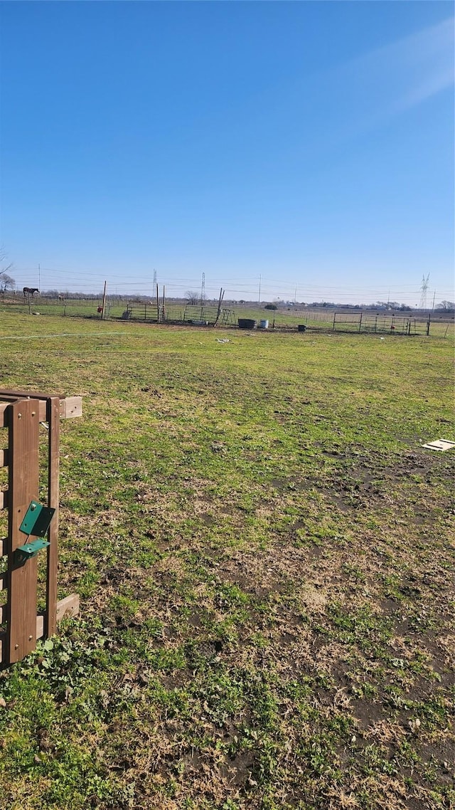 view of yard with a rural view