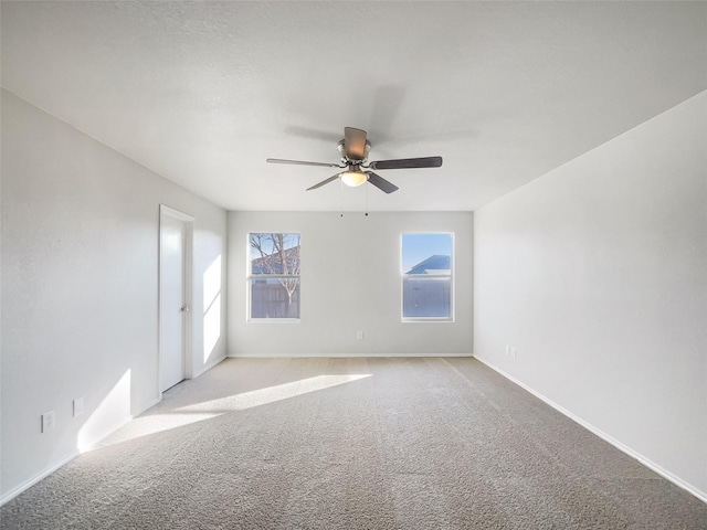 unfurnished room featuring ceiling fan and light colored carpet