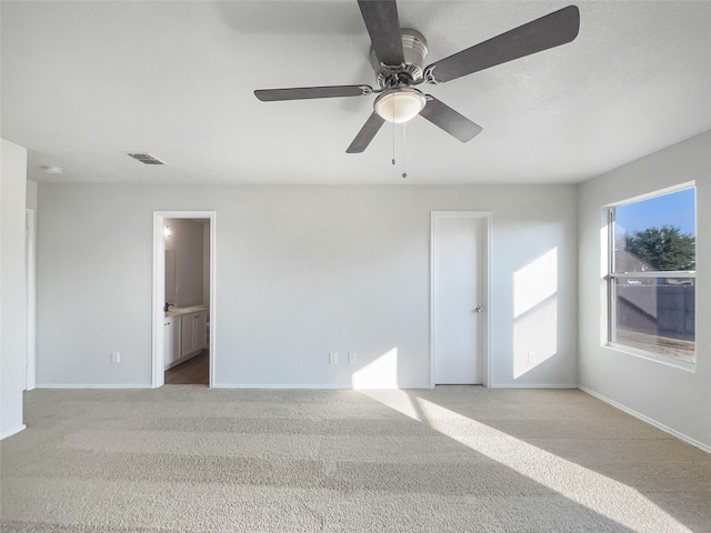 empty room with light colored carpet