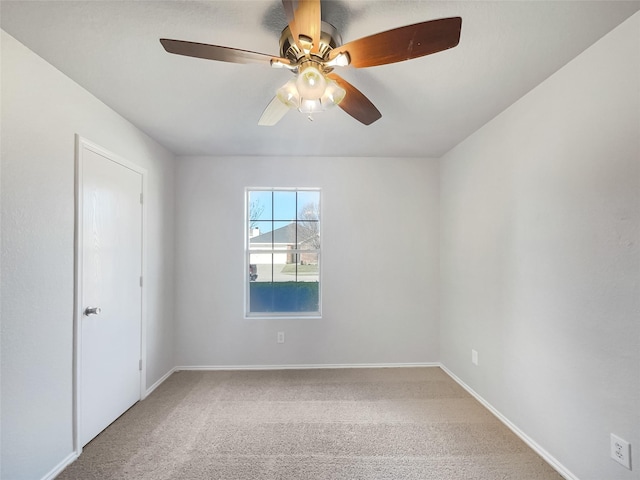 empty room with carpet floors and ceiling fan