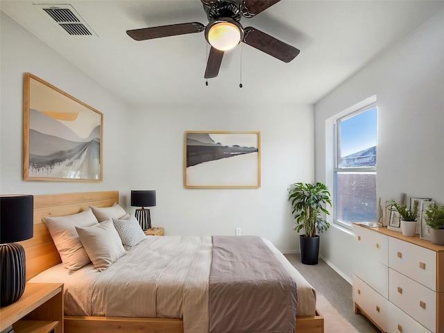 bedroom with ceiling fan and carpet floors