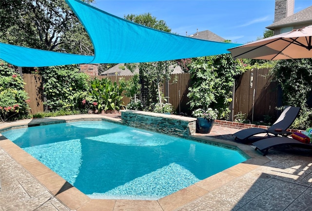 view of swimming pool with a fenced in pool, a fenced backyard, and a patio