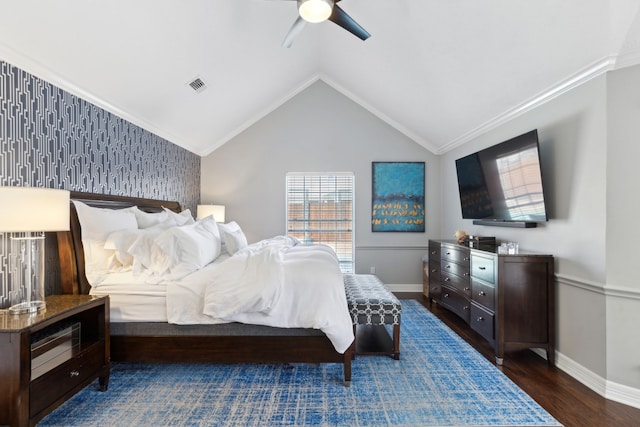 bedroom with vaulted ceiling, dark wood-type flooring, crown molding, and ceiling fan