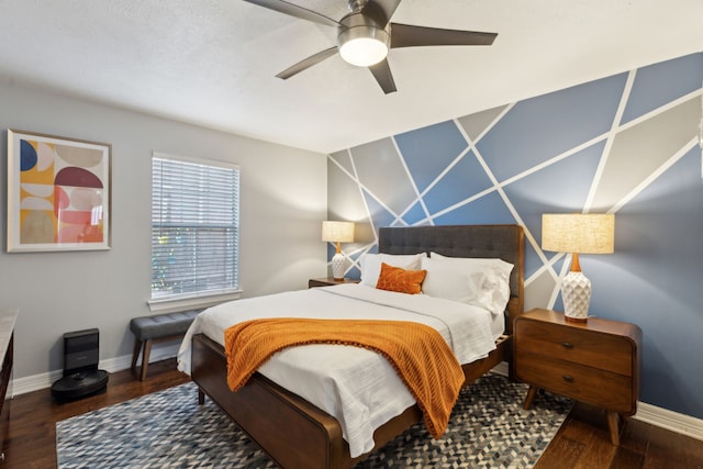 bedroom with ceiling fan and dark hardwood / wood-style floors